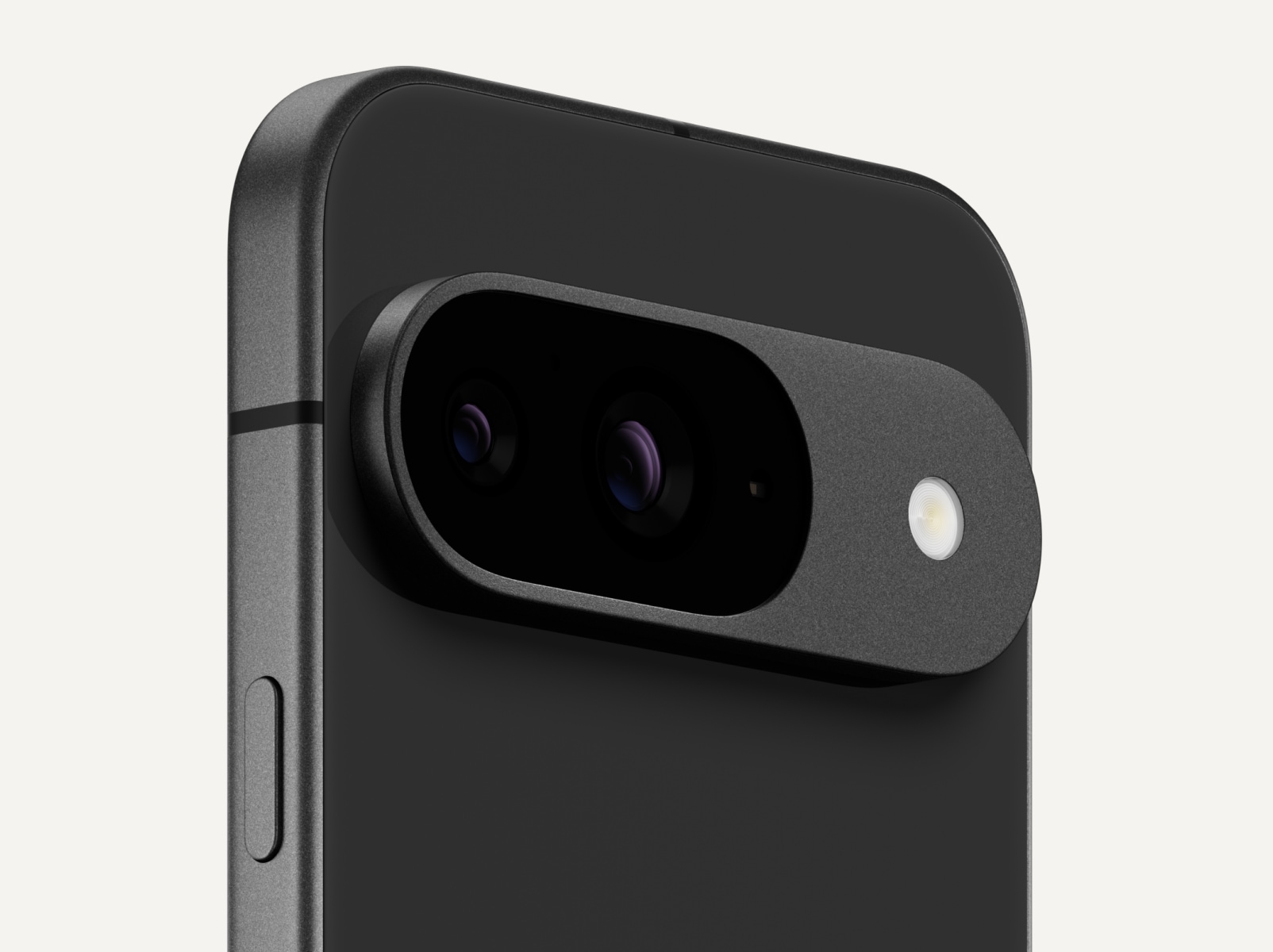 Angled close-up of the back of a Pixel 9 in Obsidian colour.