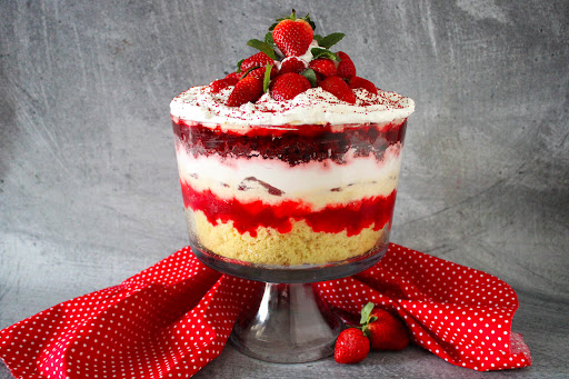 Delightfully Cool Summer Strawberry Trifle with strawberries on top.