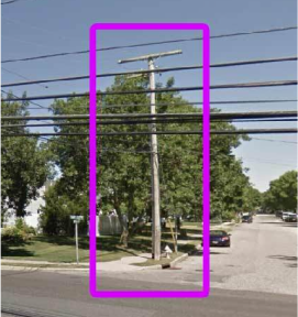 An electrical pole on a street corner with a focus rectangle around it. 
