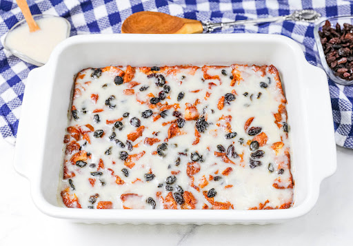 Homestyle Bread Pudding with custard sauce on top.