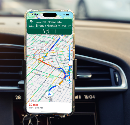 Mobile phone on a car dashboard with Google Maps UI